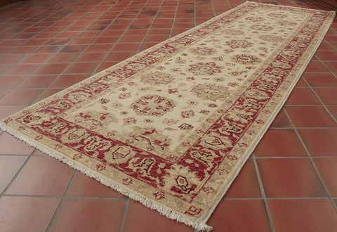 A hard wearing light coloured, hand made Ziegler design runner. 